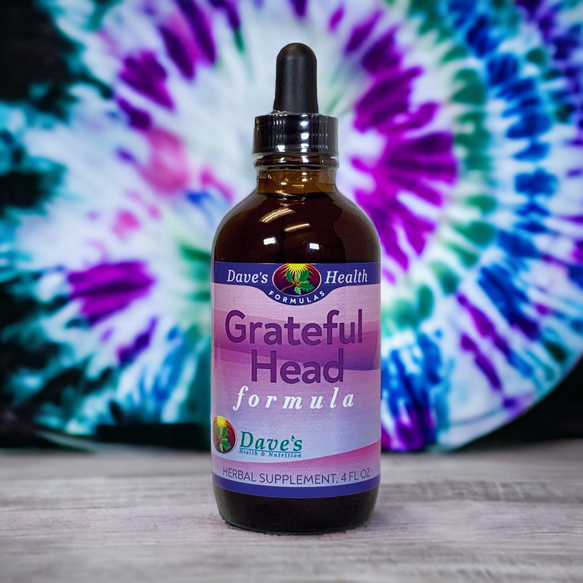 Grateful Head 4oz with tie dye background.